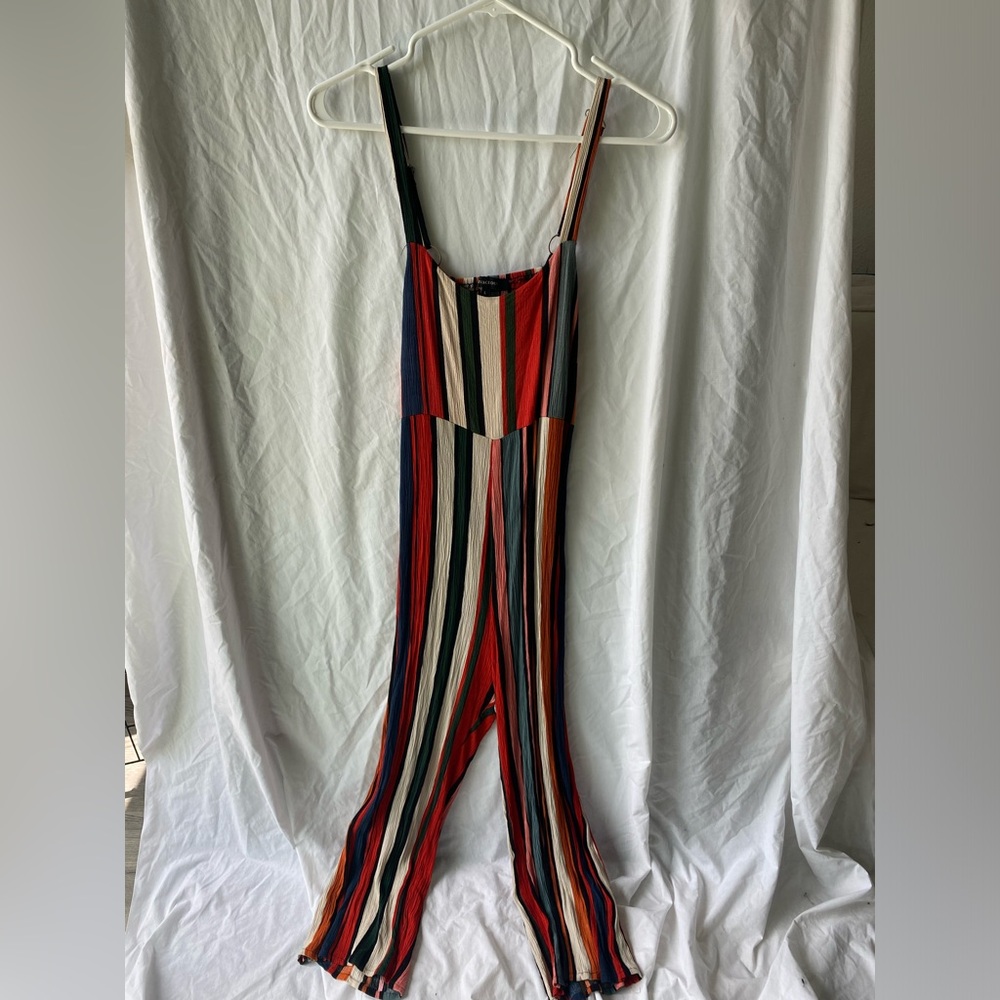 Stripped jump suit with open back, worn once